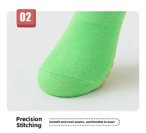 Detail of bright green anti-slip trampoline socks with precision toe stitching.
