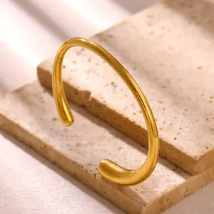 Elegant minimalist gold-plated stainless steel wavy cuff bracelet for modern women