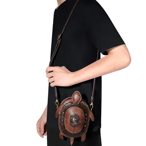 Unique turtle-shaped punk crossbody coin purse shown worn by model on black shirt