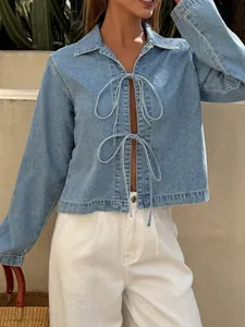 Stylish French style light blue tie-front denim jacket for women in outdoor setting