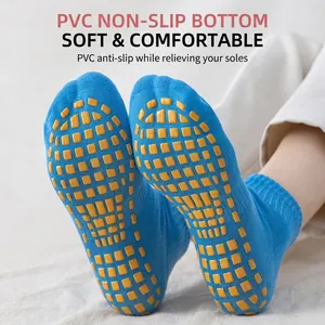 Blue anti-slip yoga trampoline socks with yellow PVC grip sole for indoor floor