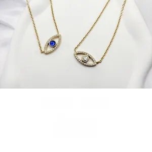 Detail view of gold-plated titanium steel evil eye necklaces with crystal accents