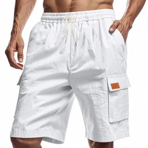 Detailed view of white linen cargo shorts with drawstring waist and flap pockets
