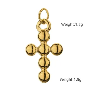 Detailed view of gold beaded cross pendant with 1.9cm height and 1.5g weight