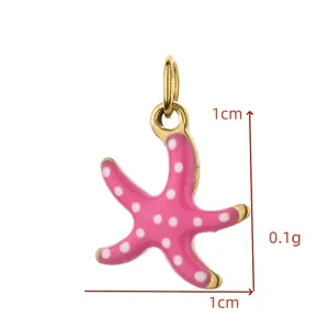 Close-up view of a pink enamel starfish charm with white polka dots for DIY jewelry