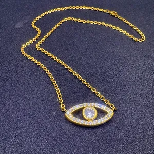 Detailed view of a gold-plated vintage Evil Eye necklace featuring sparkling crystal inlay.