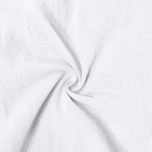 Close-up macro texture of white breathable linen fabric for men's casual shorts