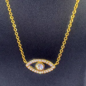 Detail view of a gold-plated evil eye necklace featuring sparkling zirconia inlay.