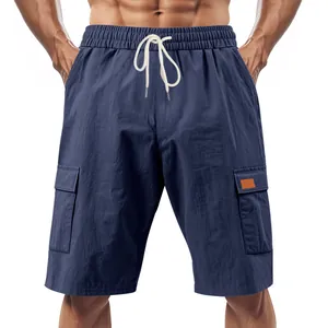 Detailed view of navy blue breathable linen cargo shorts with side pockets and drawstring.