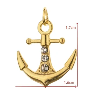 Close-up detail of a golden anchor pendant with inlaid stones for DIY jewelry.