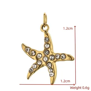 Detailed macro view of a gold-plated stainless steel starfish pendant with clear rhinestones
