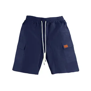 Detailed macro view of navy blue breathable linen cargo shorts with drawstrings