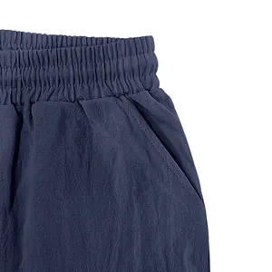 Close-up of navy blue linen casual shorts featuring elastic waistband and side pocket