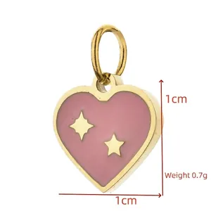 Detail view of pink enamel heart pendant with gold stars, 1cm x 1cm jewelry part