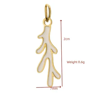 Detailed macro view of a white enamel coral branch pendant with gold plated trim.