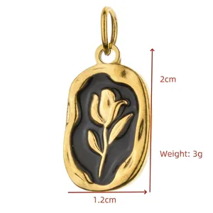 Detailed view of golden tulip enamel pendant with dimensions 2cm x 1.2cm and 3g weight