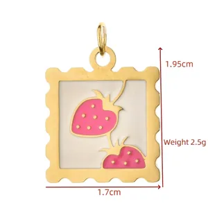 Detailed view of gold strawberry stamp pendant with 1.95cm height and 1.7cm width.