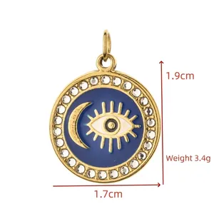 Detailed view of golden evil eye and moon pendant with 1.9cm height and 3.4g weight