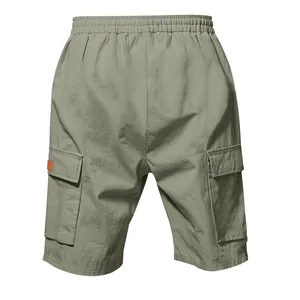 Detail of olive green men's cargo shorts with elastic waist and large side pockets