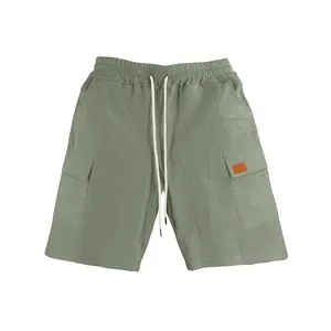 Breathable men's sage green linen cargo shorts featuring loose fit and drawstring.
