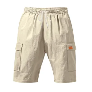 Detailed view of breathable beige linen cargo shorts with drawstring waist and pockets