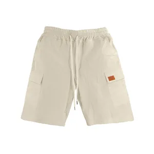 Men's beige linen cargo shorts with elastic drawstring waist and side pockets