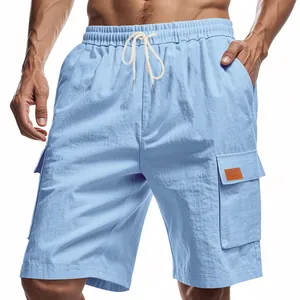 Close-up of men's breathable light blue linen cargo shorts with drawstring.