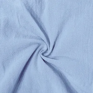 Detailed macro view of breathable light blue linen fabric texture for men's casual shorts