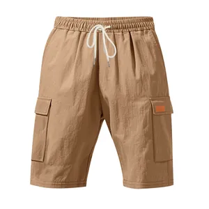 Detailed view of khaki cargo shorts with elastic drawstring waist and side pockets