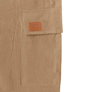 Detail view of cargo pocket and linen fabric texture on men's beach casual shorts