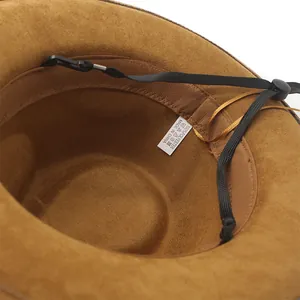 Detail view of the brown suede jazz hat interior with adjustable chin strap and label