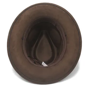 Detailed interior view of vintage brown suede fedora hat with wash label and sweatband