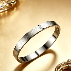 Silver stainless steel bangle with engraved Roman numerals on a luxury gold background.