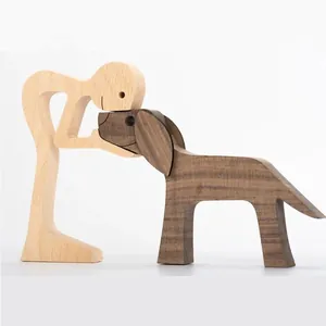 Detailed view of a minimalist wooden human and dog sculpture Nordic desk ornament