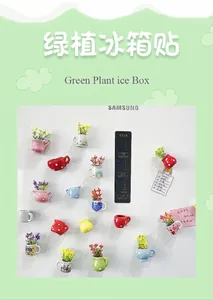 Close-up of colorful 3D ceramic vase refrigerator magnets with artificial flowers