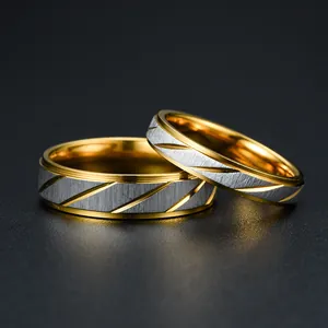 Elegant two-tone gold and silver couple rings with brushed finish and slanted grooves