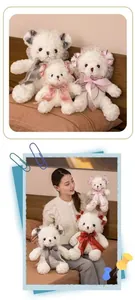 Detailed view of cute Lolita style white teddy bears with lace and colorful satin bows