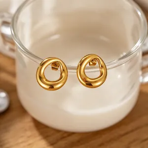 Close-up view of elegant gold irregular circular stud earrings made of titanium steel