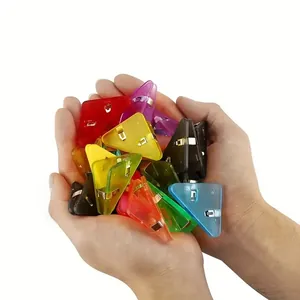 Detail showing a variety of colorful transparent plastic triangular corner paper clips