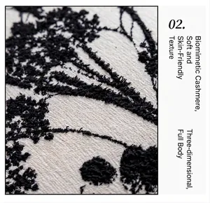 Detailed macro view showing black floral embroidery on soft faux cashmere pillow cover