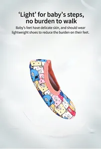 Detail view of baby indoor floor sock with colorful cartoon bear patterns.