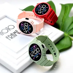 Three colorful LED digital sports watches displayed on a white photo frame