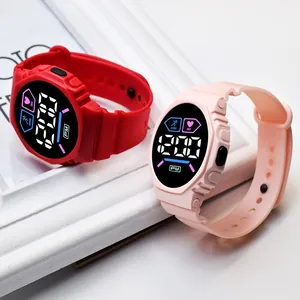 Detailed view of red and pink LED digital sports watches for students on a stylish frame.