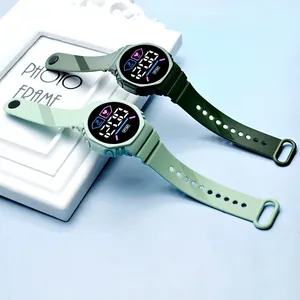 Stylish round LED digital sports watch for students in green and light green silicone.