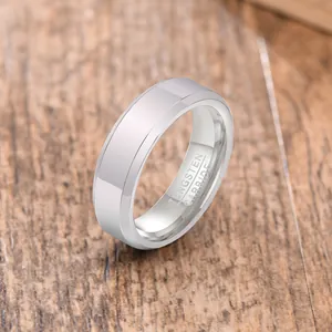 Detailed view of polished tungsten carbide ring with interior material engraving