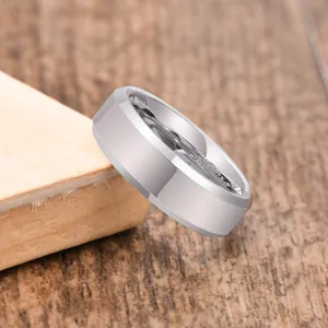 Close-up detail of a silver tungsten steel men's ring with a brushed finish band.
