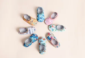 Detailed view of various colorful cartoon patterns on baby indoor anti-slip floor socks