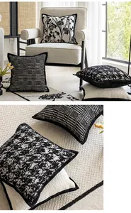 Detail shot of vintage black and white decorative throw pillow covers with floral patterns