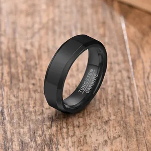 Macro view of a matte black tungsten carbide men's ring with inner engraving detail
