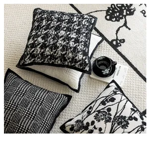 Detailed view of assorted black and white textured Nordic style cushion covers